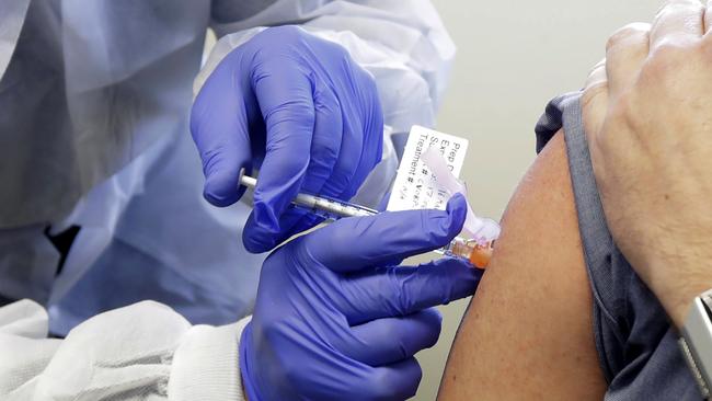 A patient receives a shot in the first-stage safety study clinical trial of a potential vaccine for COVID-19 on Monday at the Kaiser Permanente Washington Health Research Institute in Seattle. Picture: AP