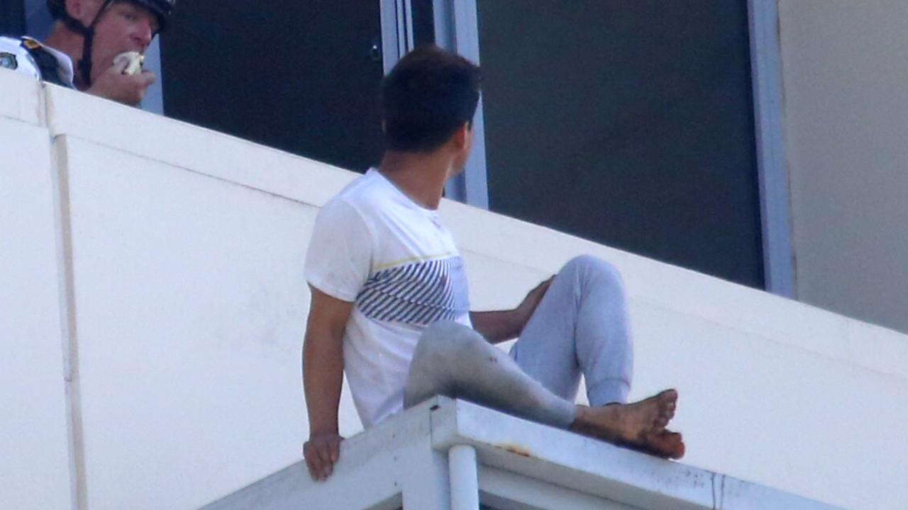 June Oh Seo sits on the balcony after murdering his girlfriend. Picture: John Grainger