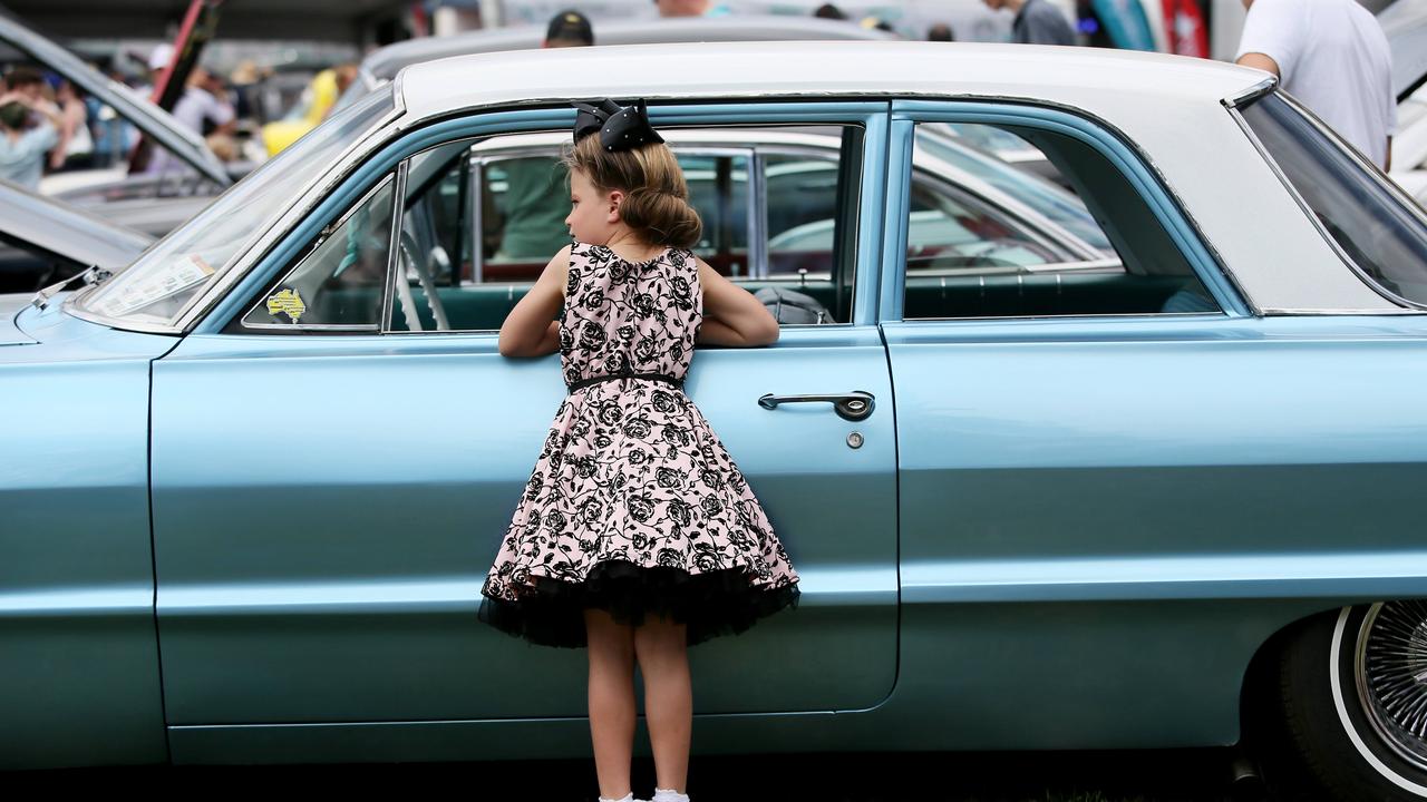 Liliana Jameson, 6, with a 1963 Chev Bel Air at CromeFest. Picture: Sue Graham