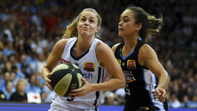 Aimee Clydesdale of the Adelaide Lightning (front) in action against Leilani Mitchell of the Canberra Capitals during game three of the WNBL grand final series in February. Picture: AAP