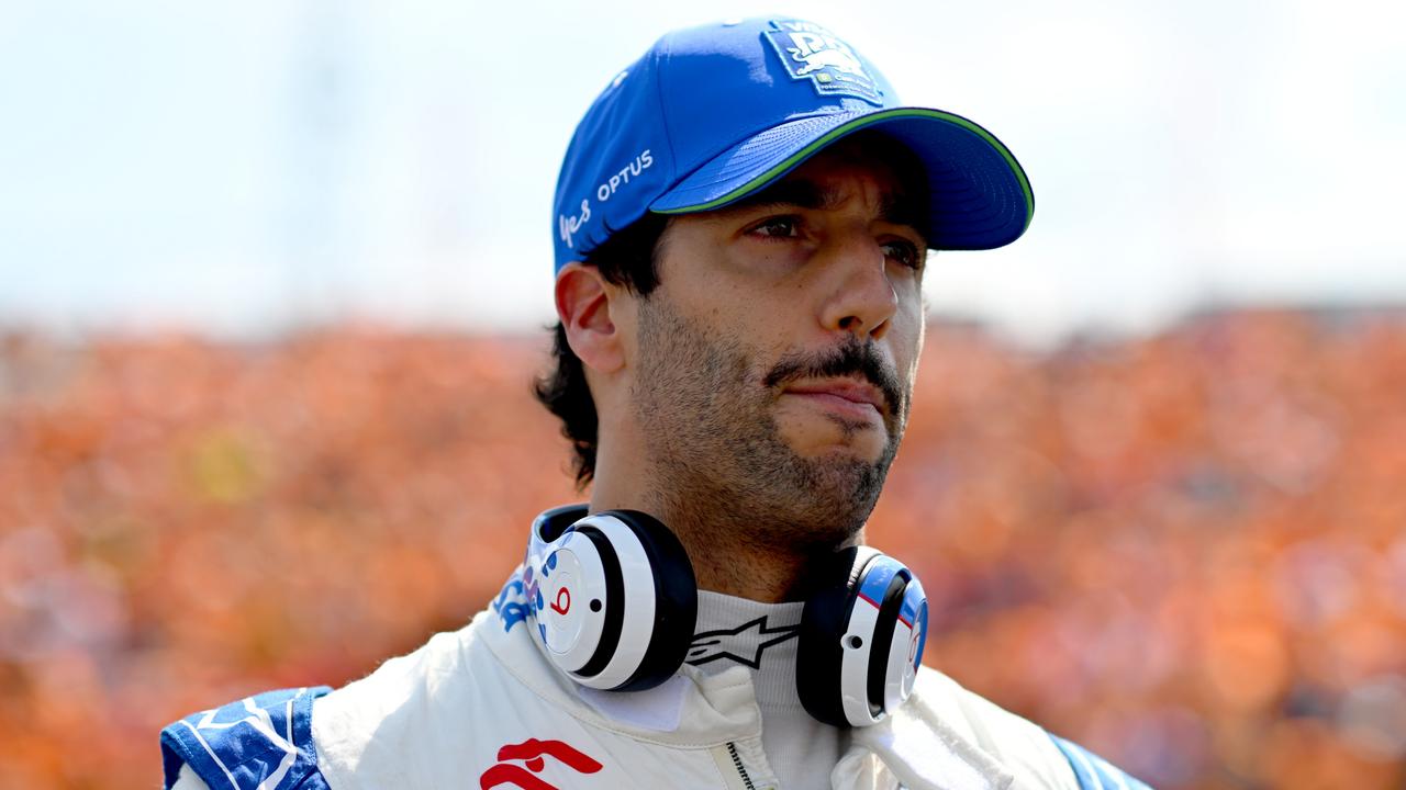 BUDAPEST, HUNGARY - JULY 21: Daniel Ricciardo of Australia and Visa Cash App RB looks on on the grid during the F1 Grand Prix of Hungary at Hungaroring on July 21, 2024 in Budapest, Hungary. (Photo by Rudy Carezzevoli/Getty Images)