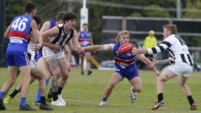 Outer East: Wandin’s Brodie Atkins prepares to tackle. Picture: Valeriu Campan