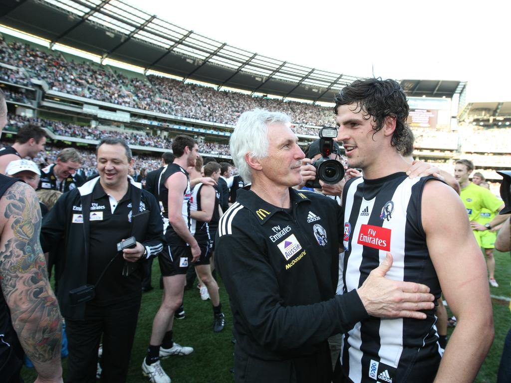 Coach Mick Malthouse hugs Scott Pendlebury after the win in the grand final replay in 2010.