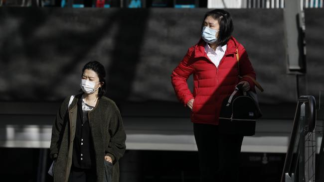 Shoppers in masks in Chatswood today. Picture: Damian Shaw