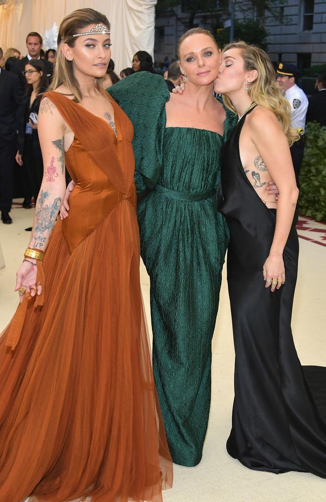 Stella McCartney, centre, with Paris Jacksin and Miley Cyrus at the Met Gala in 2018. Picture: Getty Images