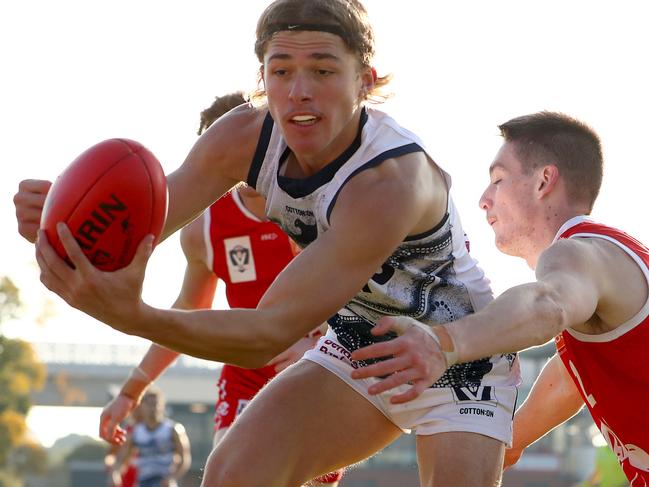 MELBOURNE, AUSTRALIA - MAY 22: Oskar Faulkhead of the Cats is tackled by Zac Hart of the Bullants during the round nine VFL match between the Northern Bullants and Geelong Cats at Preston City Oval on May 22, 2022 in Melbourne, Australia. (Photo by Kelly Defina/AFL Photos/via Getty Images)