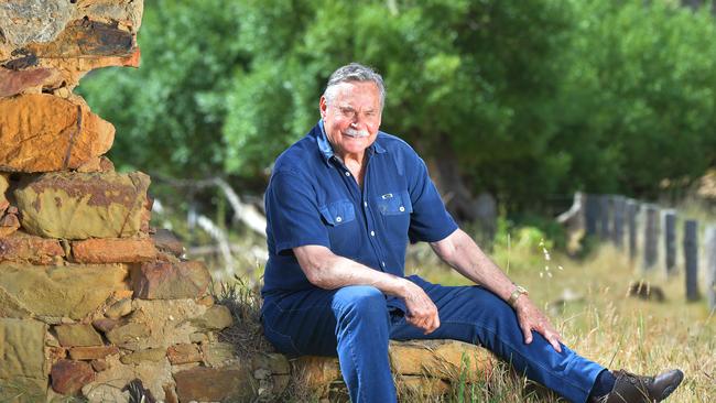 Barassi in the ruins of the old family farm. Picture:Rob Leeson.