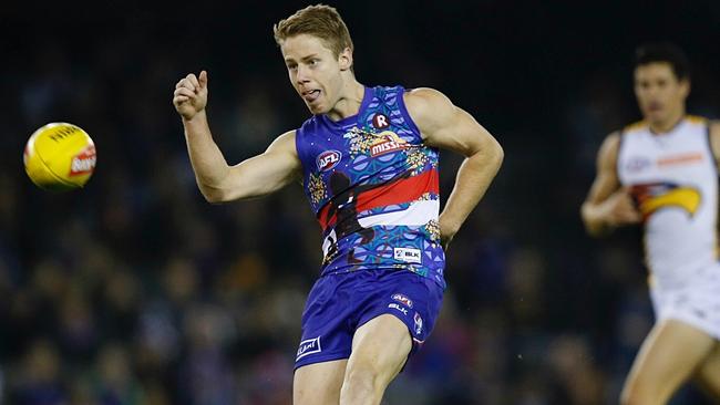 Lachie Hunter kicks the dogs into attack against West Coast. Picture: Michael Klein