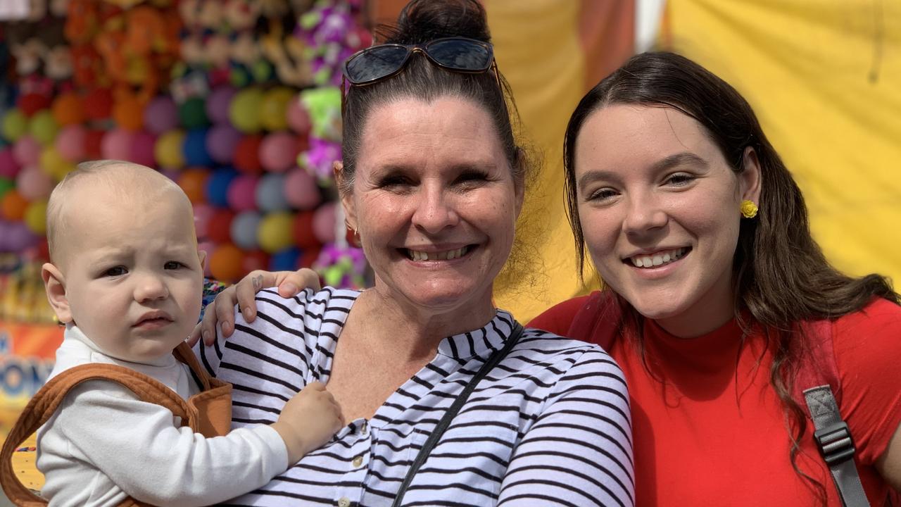 Baby Fletcher is held by Michelle Siczek next to mother Sheridan Niesler at the Mackay Show on Thursday, June 16. Picture: Duncan Evans