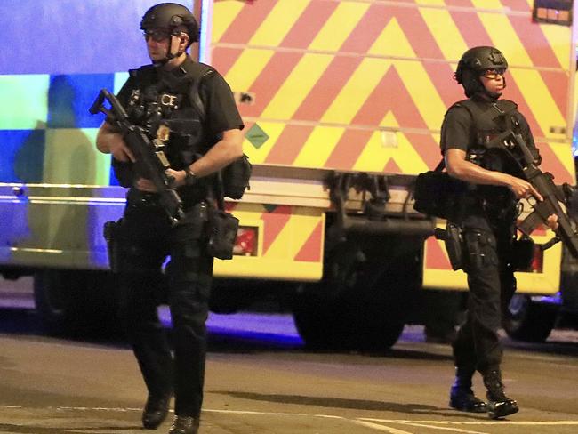 Armed police respond to the incident. Picture: AP