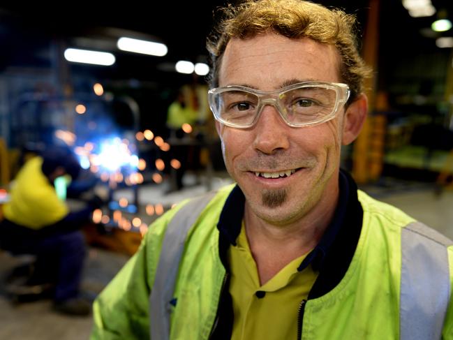 BUDGET - Manufacturing Worker Matt Sleep, a fabrication supervisor at Korvest. in the factory area with workers welding in background. Pic Campbell Brodie.