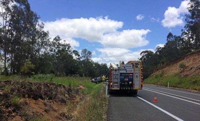 Van flips in truck crash on Bruce Hwy | The Courier Mail