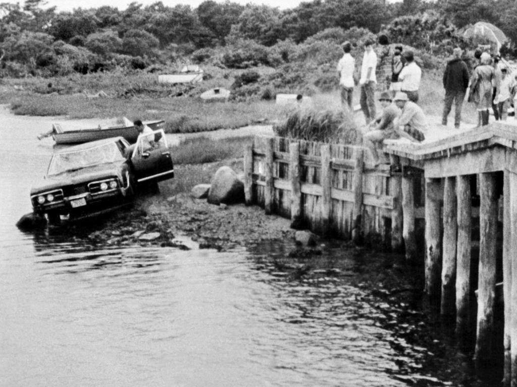 Crowds watch as U.S. Sen. Edward Kennedy's car is pulled from water in 1969. Picture: AP Photo, File.