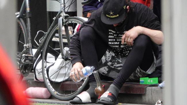 A homeless man near the corner of Elizabeth and Flinders St. Picture: Alex Coppel.