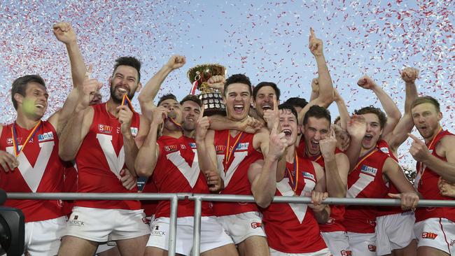 North Adelaide players celebrate their SANFL premiership at the Adelaide Oval. Picture: Sarah Reed