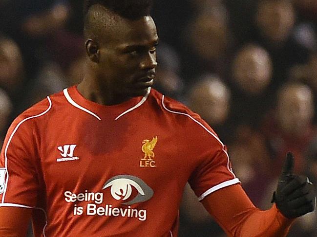 Liverpool's Italian striker Mario Balotelli gives a thumbs up after scoring Liverpool's third goal during the English Premier League football match between Liverpool and Tottenham Hotspur at the Anfield stadium in Liverpool, northwest England, on February 10, 2015. AFP PHOTO / PAUL ELLIS RESTRICTED TO EDITORIAL USE. No use with unauthorized audio, video, data, fixture lists, club/league logos or “live” services. Online in-match use limited to 45 images, no video emulation. No use in betting, games or single club/league/player publications.