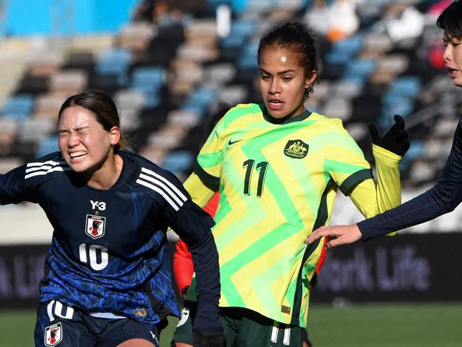 Japanâs Fuka Nagano (L) reacts as she gets tangled with Australiaâs Mary Fowler during the SheBelieves Cup football match between Japan and Australia at Shell Energy Stadium in Houston, Texas, on February 20, 2025. (Photo by Mark Felix / AFP)