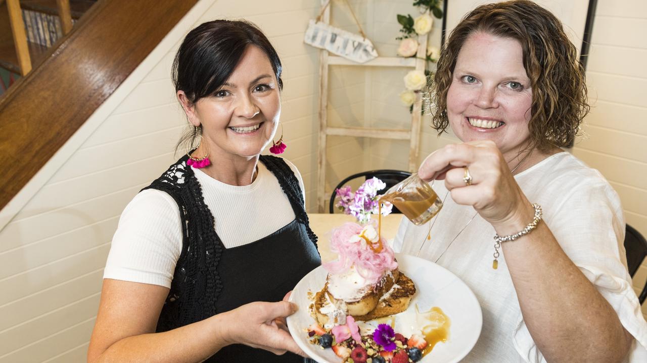 Jilly's co-owner Lisa Bentley (left) and regular customer Sharon Bernardi with the Jilly's menu item on the Toowoomba Region eats (#trEATS) foodie trail of the Carnival of Flowers. Picture: Kevin Farmer