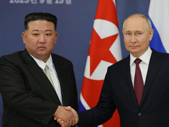 Russian President Vladimir Putin and North Korea's leader Kim Jong-un shaking hands during their meeting in 2023.