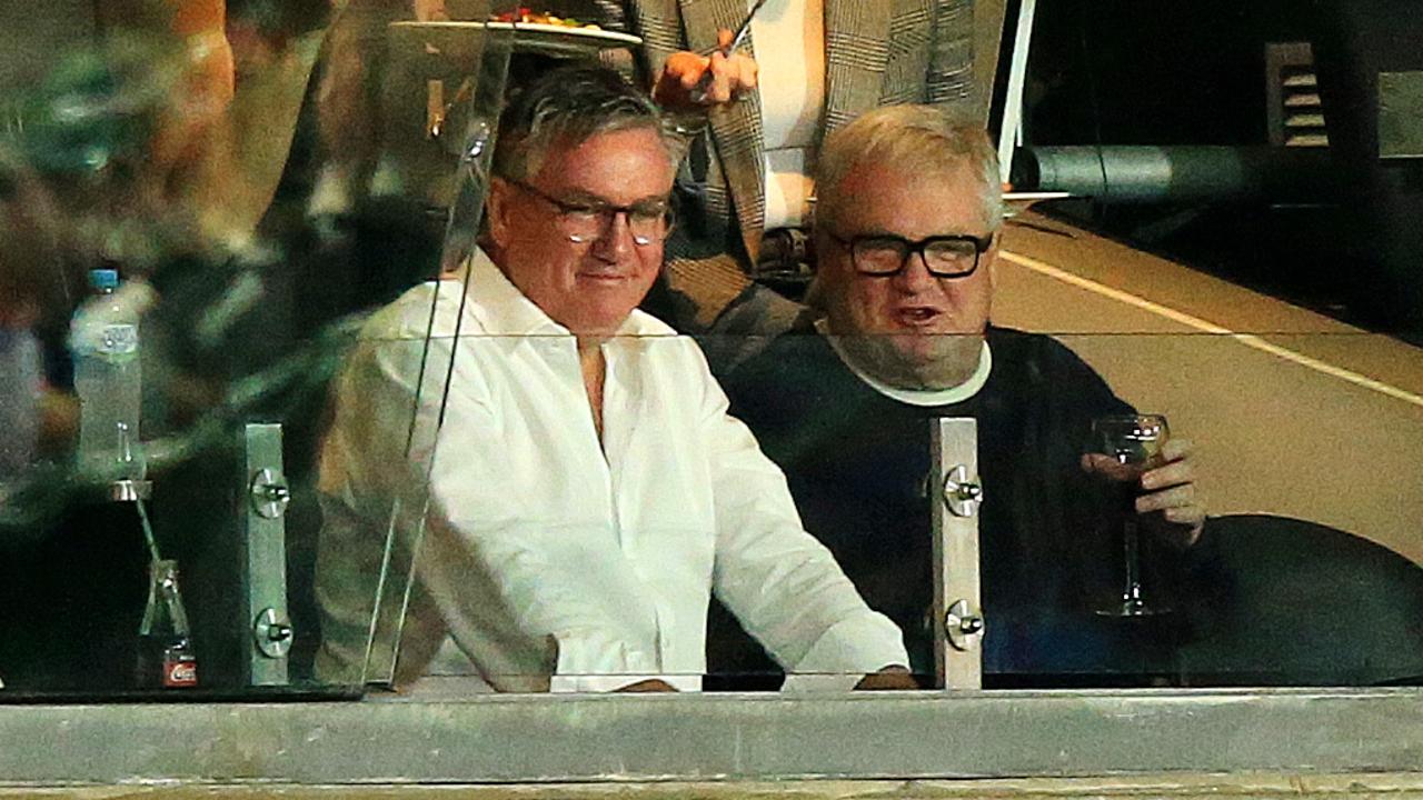 Eddie McGuire and Peter Gordon watch a match in a private box in 2021. Picture: Mark Stewart