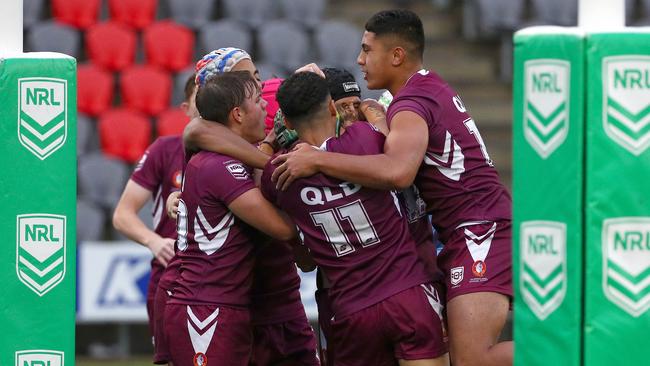 QLD players celebrate after Marley Mclaren scored a try in the under 15s lasr season. Picture: Tertius Pickard