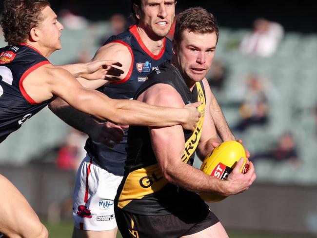 SANFL - 2nd match of a double header - Glenelg v Norwood at the Adelaide Oval. Tigers Andrew Bradley tries to get away from Norwood's Nick Pedro. Picture SARAH REED