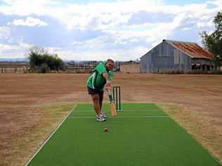 NEW WICKET: Colin Bichel admires the shiny new wicket. Picture: ANN BICHEL