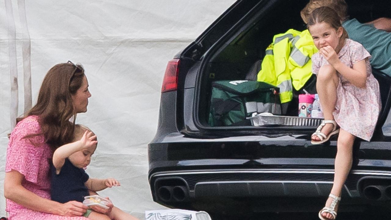 Kate feeds the kids lunch back at the car. Picture: Samir Hussein/WireImage