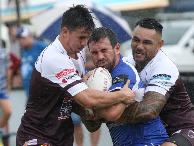 Troy Canning of Tugun tackled by Burleigh No.7 Matt Egan in 2019. Pic Mike Batterham