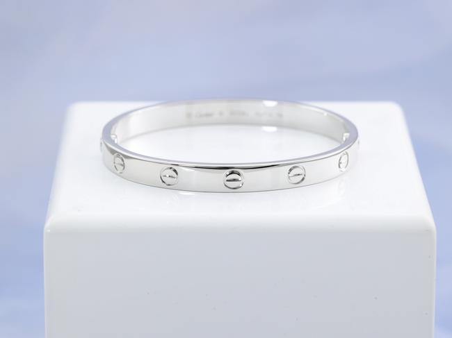 Items that were seized during Operation Elbrus, an investigation into tax fraud, are now up for auction including, , Rolex Oyster Perpetual Date Submariner, Omega Speedmaster Professional Apollo 11 45th Anniversary Limited Edition, Cartier Love bracelet in 18ct white gold, (pictured), Tiffany & Co. Elsa Peretti Diamonds by the Yard stud earrings with 2 round Natural Diamonds, Chanel medium boy flap bag in chevron quilted black