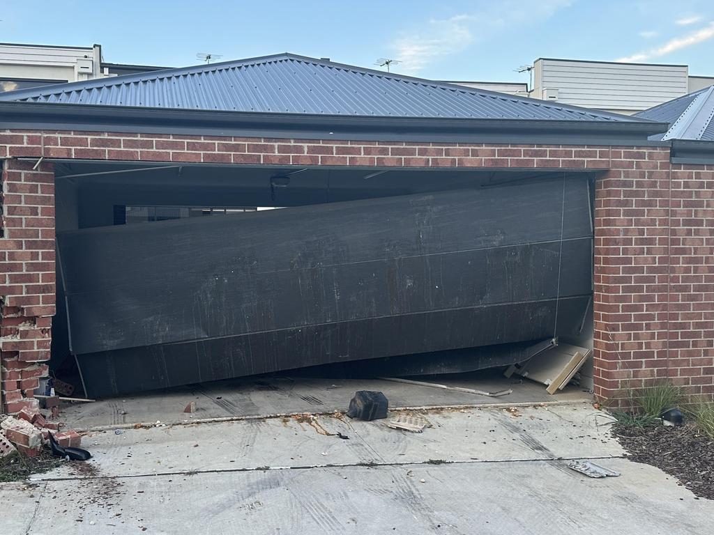 The ruined garage door.