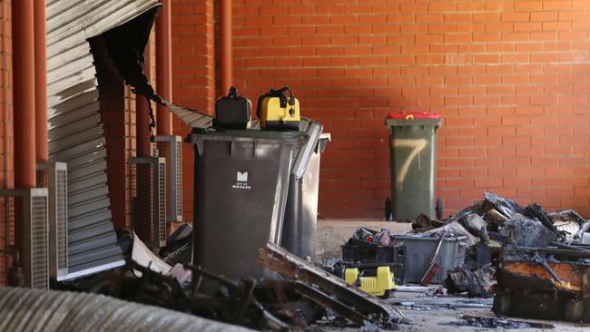 Firefighters were forced to cut their way through the garage. Picture: David Crosling