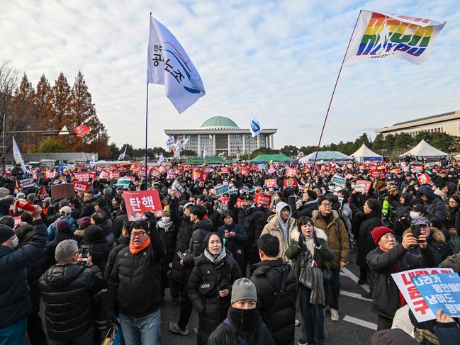 People take part in a protest calling for the ouster of South Korea President Yoon Suk Yeol outside the National Assembly in Seoul. Picture: AFP