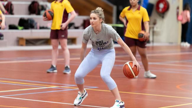 Former student Miela Goodchild returned to Moreton Bay College to take students through a basketball session.