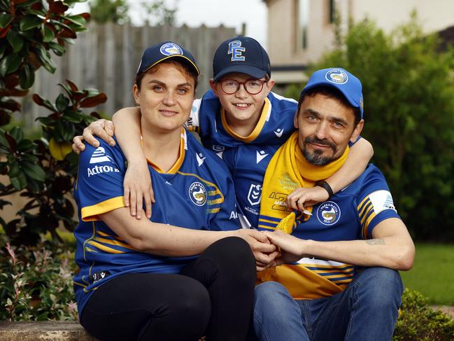 Liza and Igor with their son Petre. The Eels will host them in a private box on Sunday. Picture: Richard Dobson