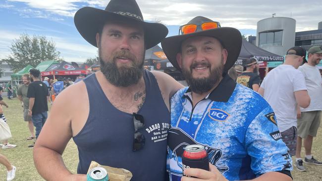 Mornington's Jack Johnston and Keysborough's Darren Last make their way through the stalls at Meatstock 2023.