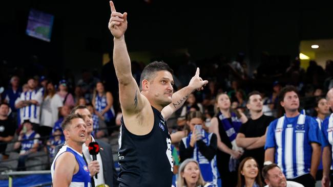 Brendan Fevola participates in the half-time Kick for the Kids.