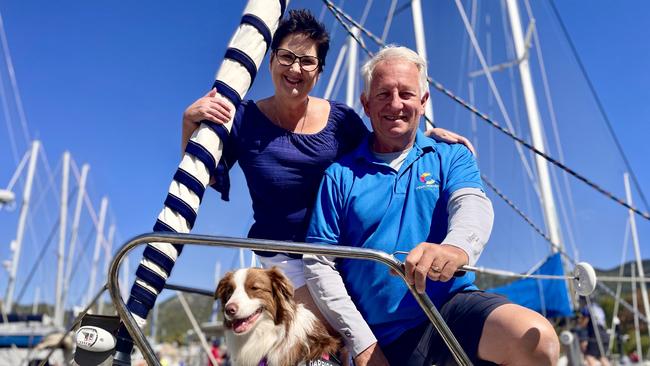 Rob and Lisa Fogarty and their sailing Border Collie Harrison-May aboard the Emma-Kate during Magnetic Island Race Week.