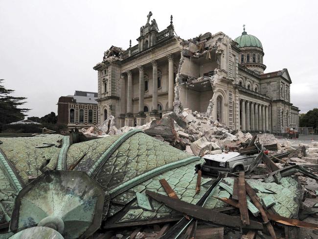 Debris crushes a car outside the Cathedral of the Blessed Sacrament after a 6.3 magnitude earthquake rocked Christchurch in 2011.