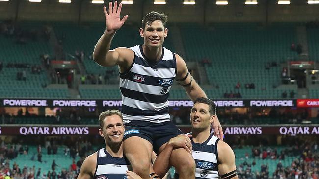 Geelong’s Tom Hawkins is chaired off the SCG in his 250th game by Joel Selwood and Harry Taylor after the win over Sydney Swans. Picture: Phil Hillyard