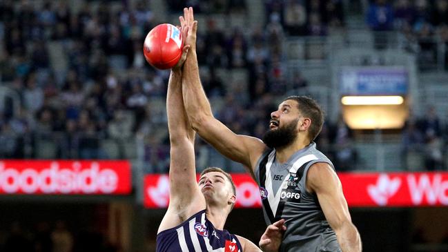 Fremantle’s Sean Darcy contests a tap with Port Adelaide’s Paddy Ryder during the Round 13 match at Optus Stadium in Perth. Picture: AAP Image/Richard Wainwright