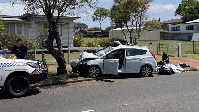 Police are investigating after a large quantity of prescription drugs and a weapon were discovered after a vehicle crashed into a tree along Alderley St in Rangeville on November 15, 2023.