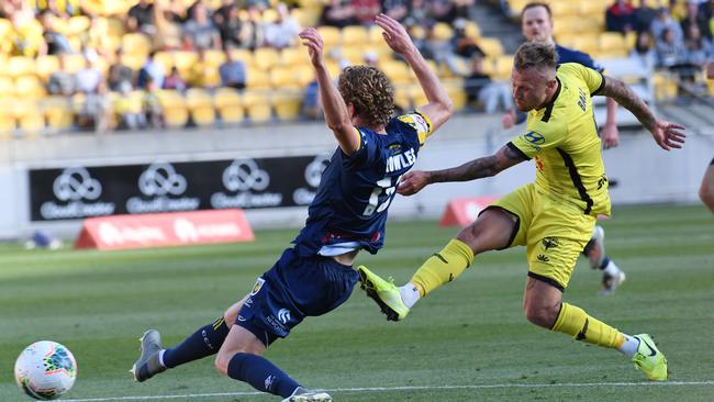 David Ball of the Phoenix, right, clears the ball past Kye Rowles of the Mariners during the round-13 A-League match between the Wellington Phoenix and the Central Coast Mariners in Wellington on Saturday. Picture: AAP Image/SNPA