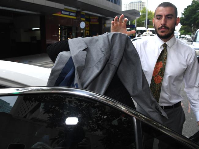 Costigan bundled into a car outside the Downing Centre this morning. Picture: NCA NewsWire/Joel Carrett