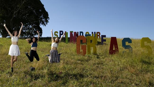 Yay for Byron! Young fans pose in front of a festival sign at Splendour In the Grass. Photo by Mark Metcalfe/Getty Images.