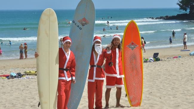 Misato Kumamoto, Sven Sahli and Koki Nakano on Noosa Main beach in Santa suits.