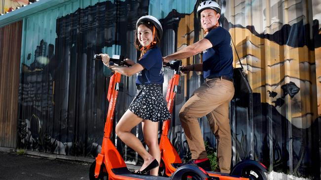 Joe Oliver (Head of Communications) and Valeri Inting (Adelaide City Launcher) with the new Neuron Scooters. Picture: Tricia Watkinosn