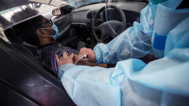 A nurse administers the Pfizer Covid-19 vaccine at a drive through vaccination centre in Melton in Melbourne on Monday. Picture: Getty Images