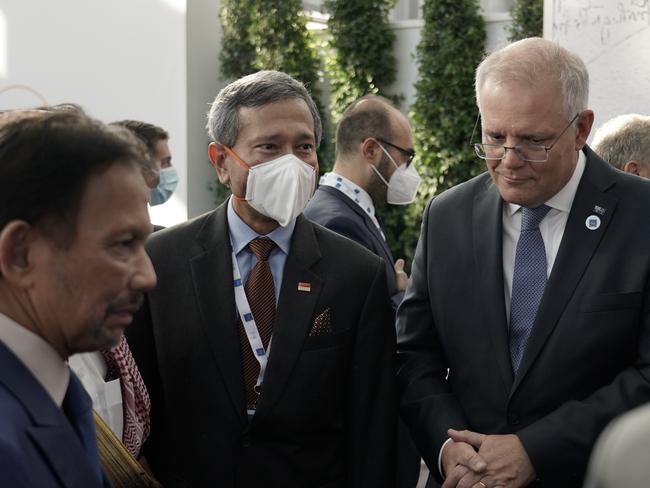 Australian Prime Minister Scott Morrison attends the G20 Official Welcome and Family photo and chats with Sultan Hassanal Bolkiah (ASEAN Chair) and Singapore Prime Minister Lee Hsien Loong in Rome on October 30. Picture: Adam Taylor