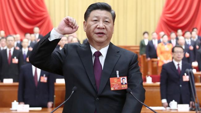 Xi Jinping takes a public oath of allegiance to the Constitution in the Great Hall of the People in Beijing. Picture: Xinhua/Ju Peng.